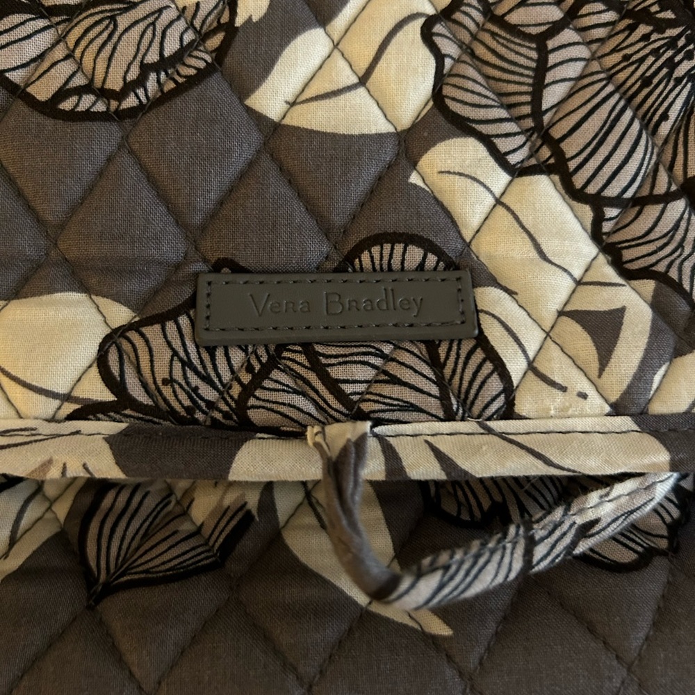 Vera Bradley toiletry bag with a hanger on the top